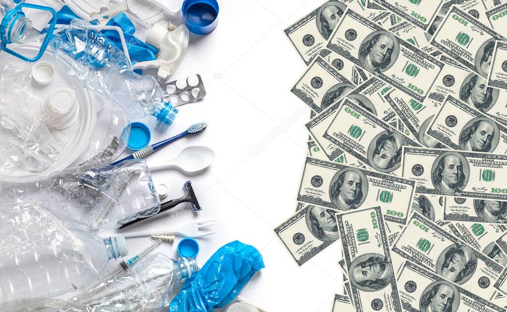 Trash to treasure. Making money in plastic recycling business. Pile of different trash and usd dollars on white background.