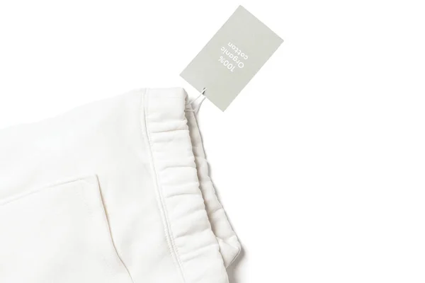 白色100 有机棉运动裤纸标签的特写 — 图库照片