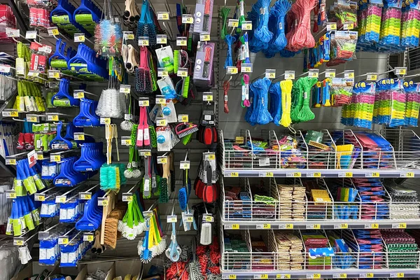 Tools for cleaning in the store. Shopping with background of blue equipments on shelf in store.