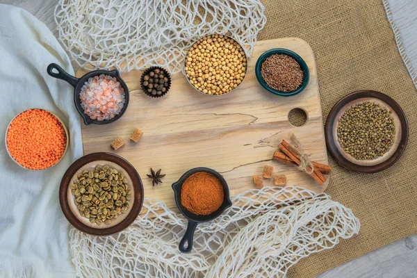 Set with organic products in bowls. Eco bag for shopping. Zero waste shopping and storage farm products. Top view.