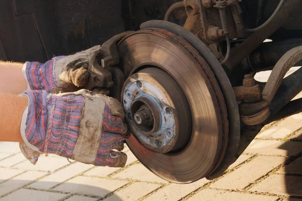 Repair of a wheel on a passenger car. Wheel balancing or repair. Car repair concept