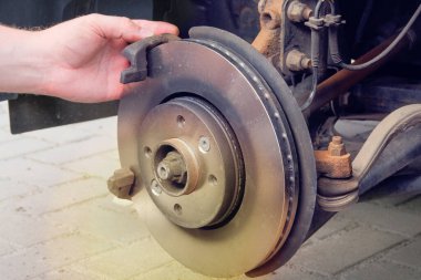 Automobile maintenance concept. Wheel balancing or repair. Cars and transportation repair, close up.