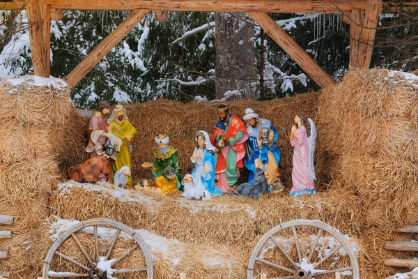 Christmas Nativity scene. Festive installation. Night with the birth of Jesus.