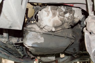 Bottom-left view of a car gearbox with the left half-axle removed