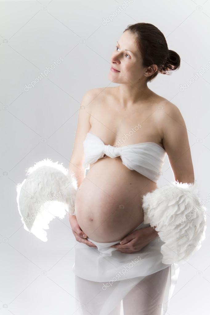 Pregnant woman with angel wings.