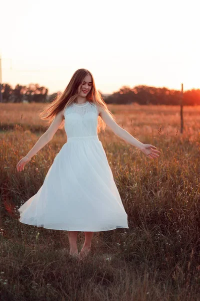 Pretty Cute Girl Circling White Dress Field Sun Rays Orange — ストック写真