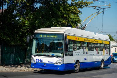 CHISINAU, MOLDOVA - September 13, 2021. Trolleybus Skoda 24Tr Irisbus #2445 (ex. Riga #18208) riding with passengers in the streets of Chisinau.