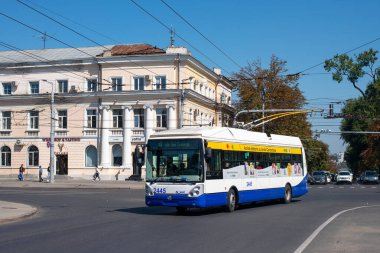 CHISINAU, MOLDOVA - September 13, 2021. Trolleybus Skoda 24Tr Irisbus #2445 (ex. Riga #18208) riding with passengers in the streets of Chisinau.