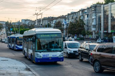 CHISINAU, MOLDOVA - September 14, 2021. Trolleybuses Skoda 24Tr Irisbus #3937 (ex. Riga #18089) and RTEC 62321 (BKM) #1375 riding with passengers in the streets of Chisinau.
