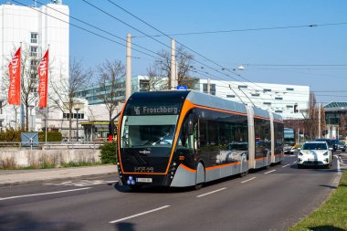 LINZ, AUSTRIA - MARCH 26, 2022. Trolleybus Van Hool Exqui.City 24 #223 riding with passengers in the streets of  Linz.