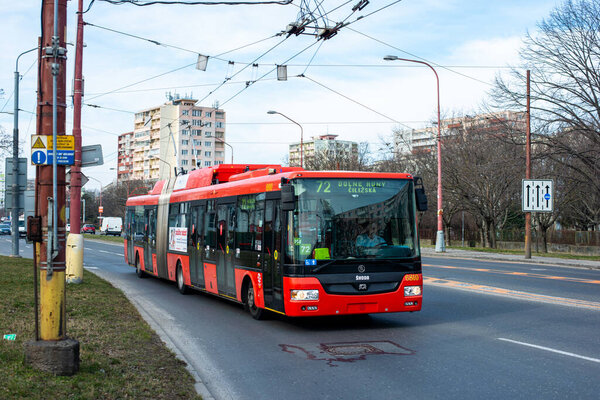 BRATISLAVA, SLOVAKIA - MARCH 03, 2022. Trolleybus Skoda 31Tr SOR #6810 riding with passengers in the streets of Bratislava.