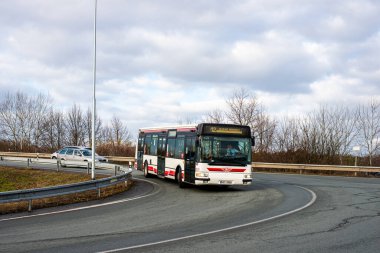 PARDUBICE, CZECH REPUBLIC - February 23, 2022. Bus Irisbus Citelis 12M #201 riding with passengers in the streets of Pardubice.
