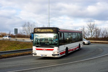 PARDUBICE, CZECH REPUBLIC - February 23, 2022. Bus Irisbus Citelis 12M #201 riding with passengers in the streets of Pardubice.