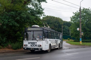 CHERNIVTSI, UKRAINE - August 13, 2022. Trolleybus Skoda 14Tr #365 (ex. Brno #3246) riding with passengers in the streets of Chernivtsi.