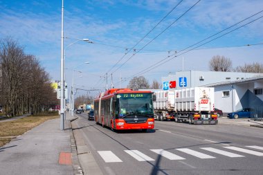 BRATISLAVA, SLOVAKIA - MARCH 03, 2022. Trolleybus Skoda 31Tr SOR #6818 riding with passengers in the streets of Bratislava.