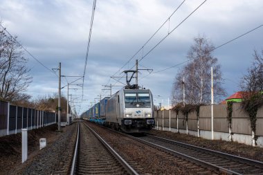 PARDUBICE, CZECH REPUBLIC - February 23, 2022. Locomotive Bombardier Traxx F140 MS2e #186 351-3 riding in the streets of Pardubice.