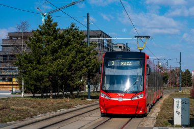 BRATISLAVA, SLOVAKIA - MARCH 07, 2022. Tram Skoda 30T2 #7519 riding with passengers in the streets of Bratislava.
