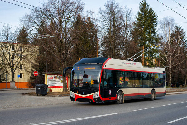 JIHLAVA, CZECH REPUBLIC - February 24, 2022. Trolleybus Skoda 32Tr SOR #14 riding with passengers in the streets of Jihlava.