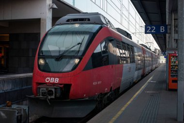 LINZ, AUSTRIA - MARCH 26, 2022. Train Bombardier Talent #4024 051-7 riding with passengers in the streets of  Linz.