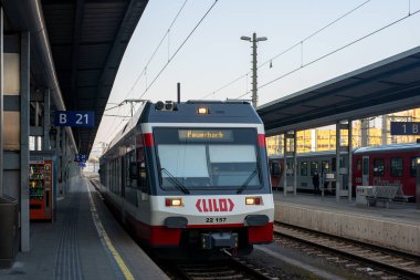LINZ, AUSTRIA - MARCH 26, 2022. Train Stadler ET 22 #22 157 riding with passengers in the streets of  Linz.