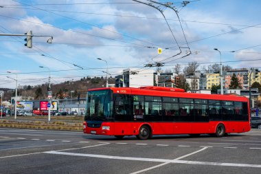 BRATISLAVA, SLOVAKIA - MARCH 08, 2022. Bus SOR NB 12 City #1030 riding with passengers in the streets of Bratislava.