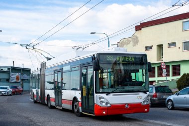 BRATISLAVA, SLOVAKIA - MARCH 08, 2022. Trolleybus Skoda 25Tr Irisbus #6701 riding with passengers in the streets of Bratislava. clipart