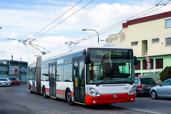 BRATISLAVA, SLOVAKIA - MARCH 08, 2022. Trolleybus Skoda 25Tr Irisbus #6701 riding with passengers in the streets of Bratislava.