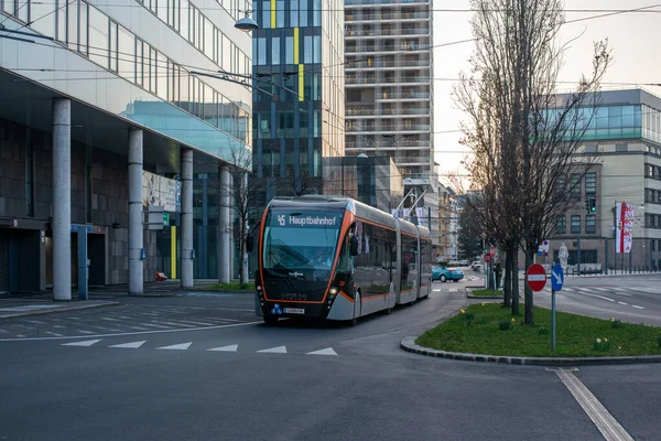 LINZ, AUSTRIA - MARCH 26, 2022. Trolleybus Van Hool Exqui.City 24 #228 riding with passengers in the streets of  Linz.