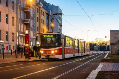 PRAGUE, CZECH REPUBLIC - February 23, 2022. Tram Tatra KT8D5 #9058 riding with passengers in the streets of Prague.