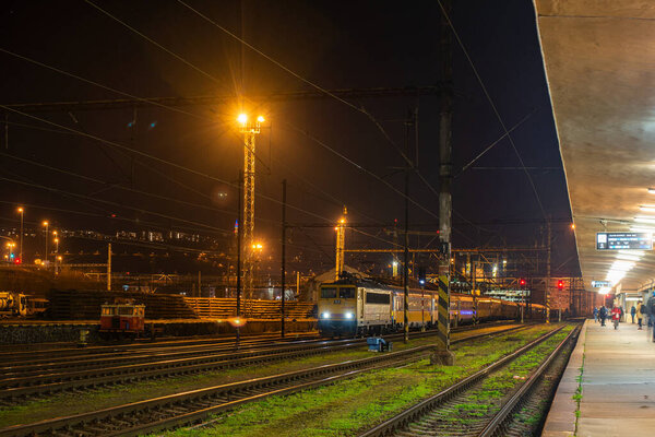 PRAGUE, CZECH REPUBLIC - February 23, 2022. Locomotive Skoda 98E1 #162 112-7 riding with passengers in the streets of Prague.