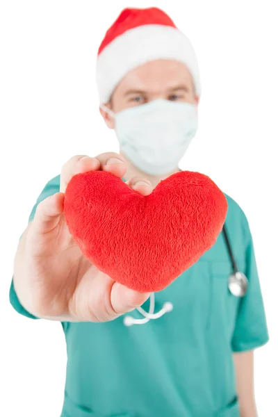 Doctor with toy heart in hand — Stock Photo, Image