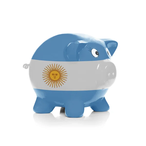 Piggy bank met vlag coating overheen - Argentinië — Stockfoto