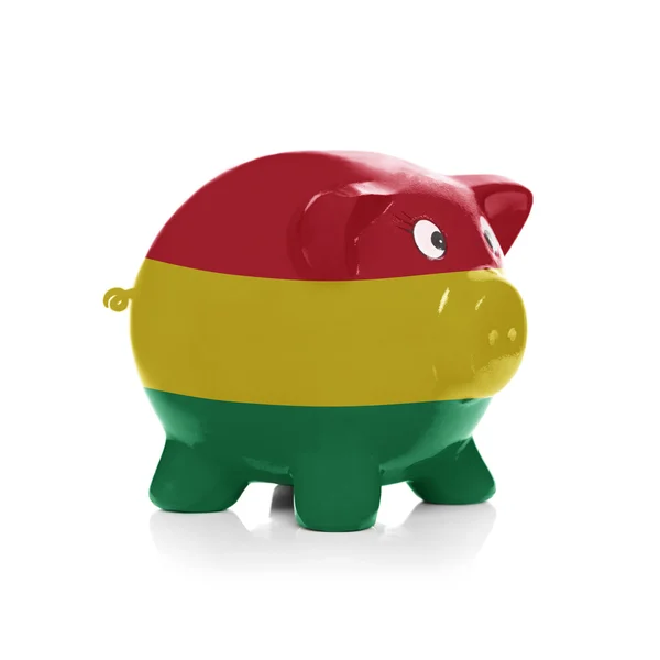 Sparschwein mit Flagge Beschichtung drüber - Bolivien — Stockfoto