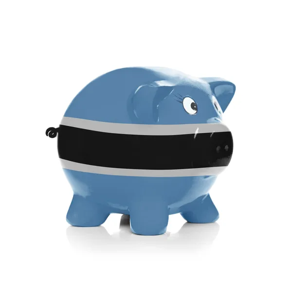 Piggy bank met vlag coating overheen - botswana — Stockfoto