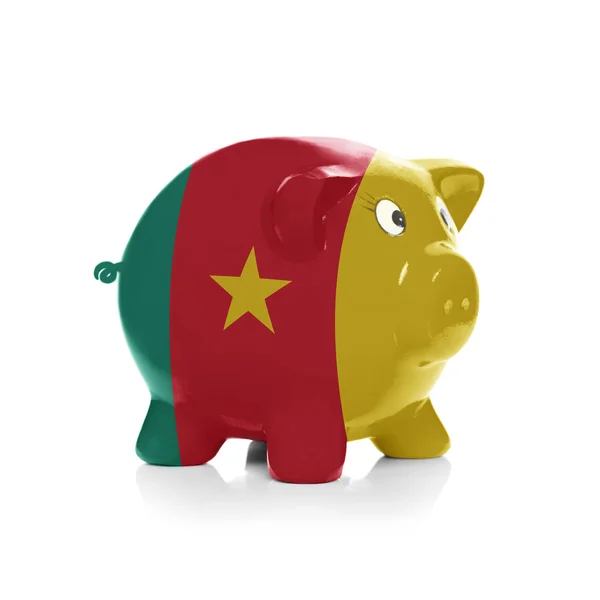 Piggy bank met vlag coating overheen - Kameroen — Stockfoto