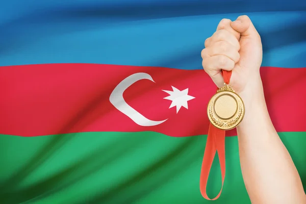 Medal in hand with flag on background - Republic of Azerbaijan — Stock Photo, Image