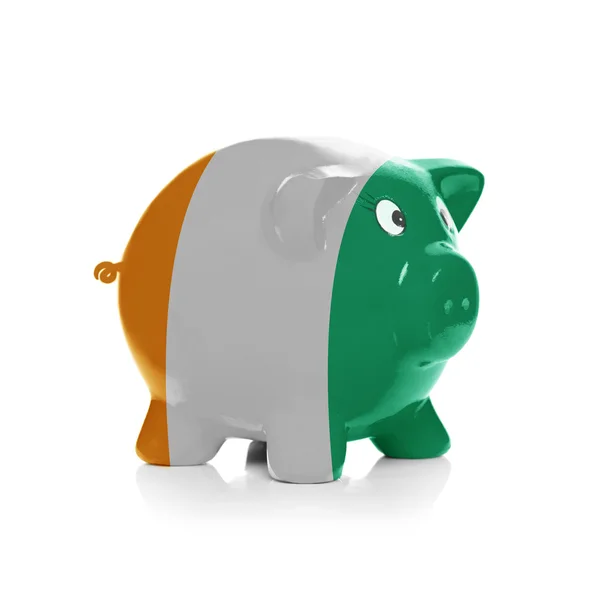Piggy bank with flag coating over it - Cote d'Ivoire — Stock Photo, Image