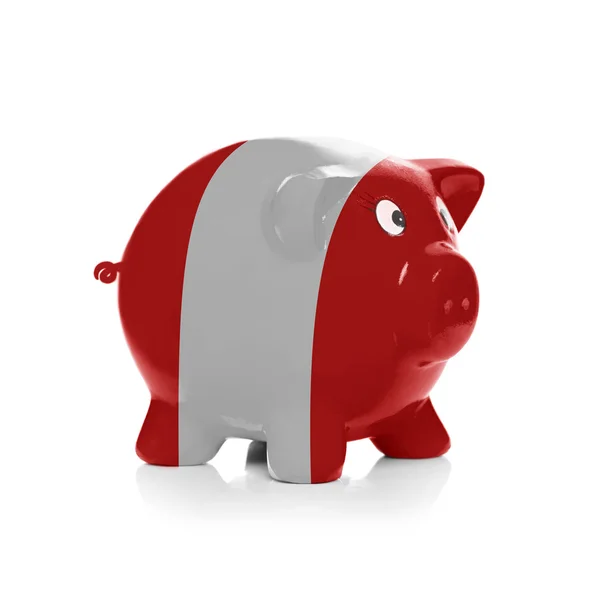 Piggy bank with flag coating over it - Peru — Stock Photo, Image