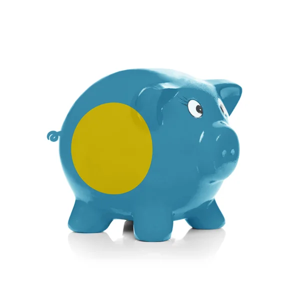 Piggy bank met vlag coating overheen - palau — Stockfoto