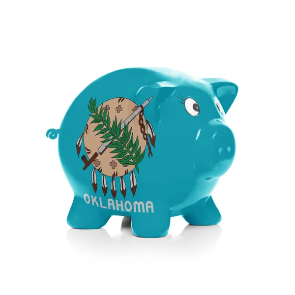 Piggy bank with flag coating over it - State of Oklahoma — Stock Photo, Image