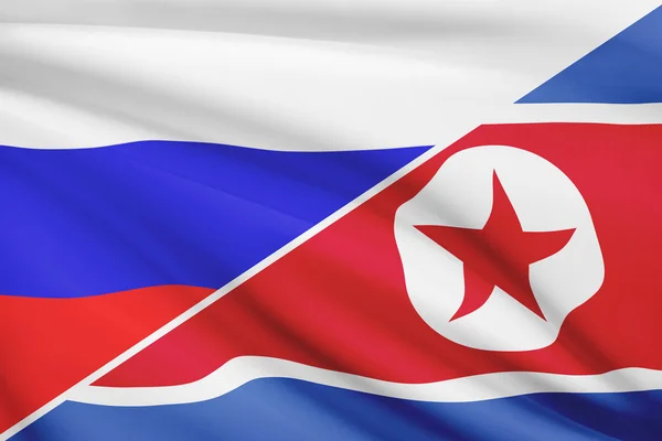 Series of ruffled flags. Russia and North Korea. — Stock fotografie