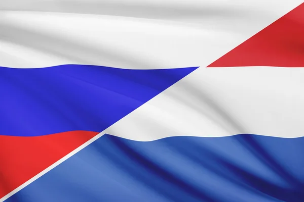 Series of ruffled flags. Russia and Netherlands. — Stock Photo, Image