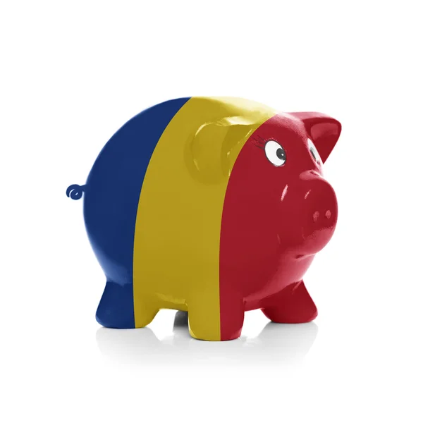 Piggy bank with flag coating over it - Romania — Stock Photo, Image
