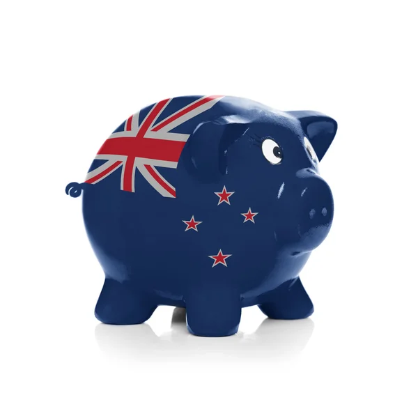 Piggy bank with flag painting over it - New Zealand — Stock Photo, Image