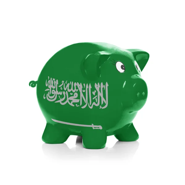 Piggy bank with flag coating over it - Saudi Arabia — Stock Photo, Image