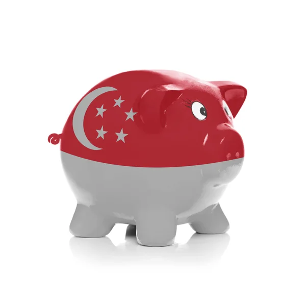 Piggy bank with flag coating over it - Singapore — Stock Photo, Image