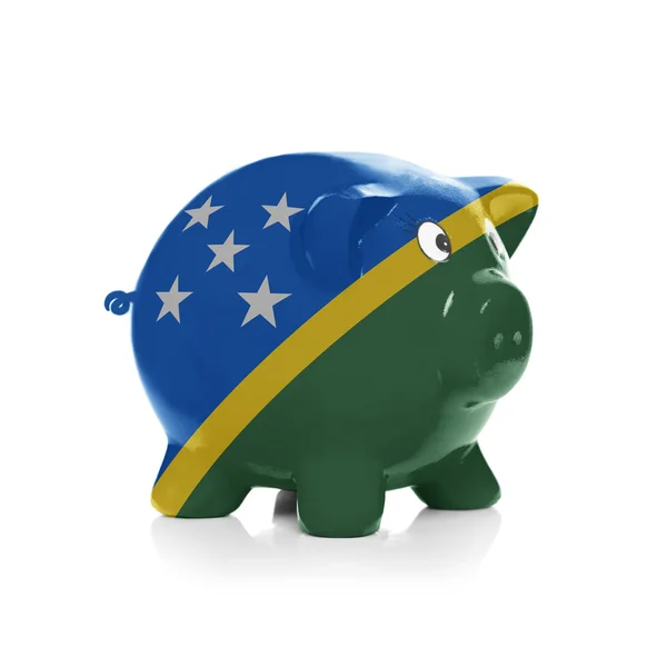 Piggy bank with flag coating over it - Solomon Islands — Stock Photo, Image