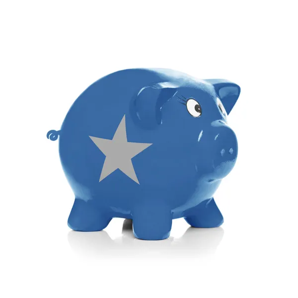 Piggy bank with flag coating over it - Somalia — Stock Photo, Image