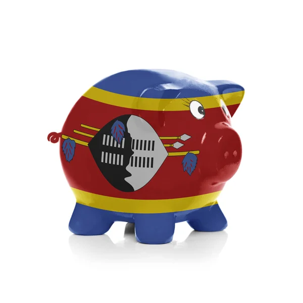 Piggy bank with flag coating over it - Swaziland — Stock Photo, Image