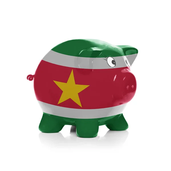 Piggy bank with flag coating over it - Suriname — Stock Photo, Image